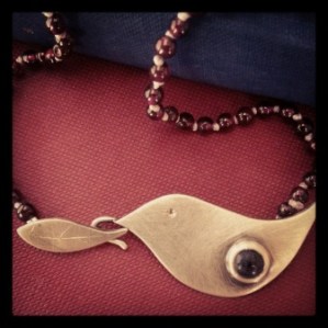 Bird and leaf clasp with garnets